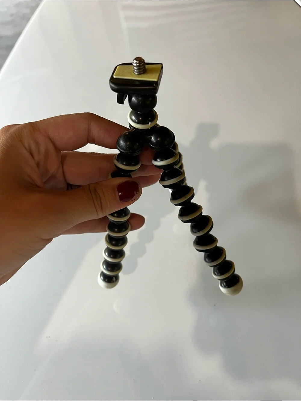 GoPro HERO 3 with Yellow Floating Hand Grip and Black/White Flexible Tripod